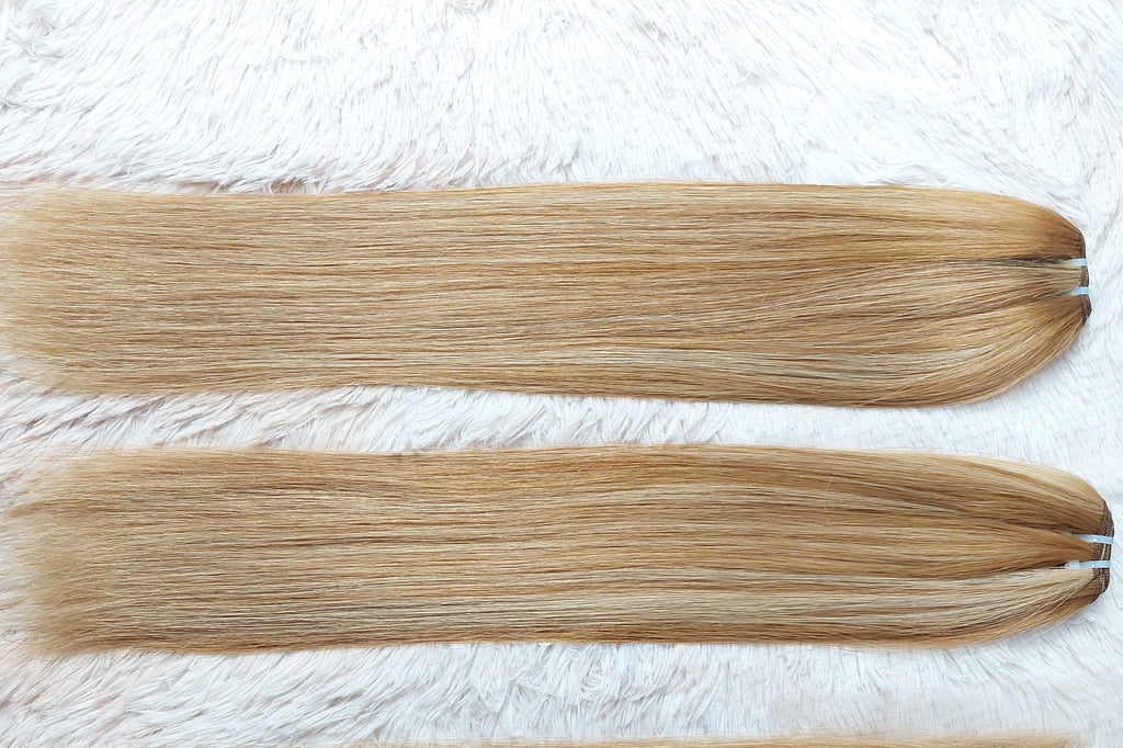 Weft hair extensions piano color