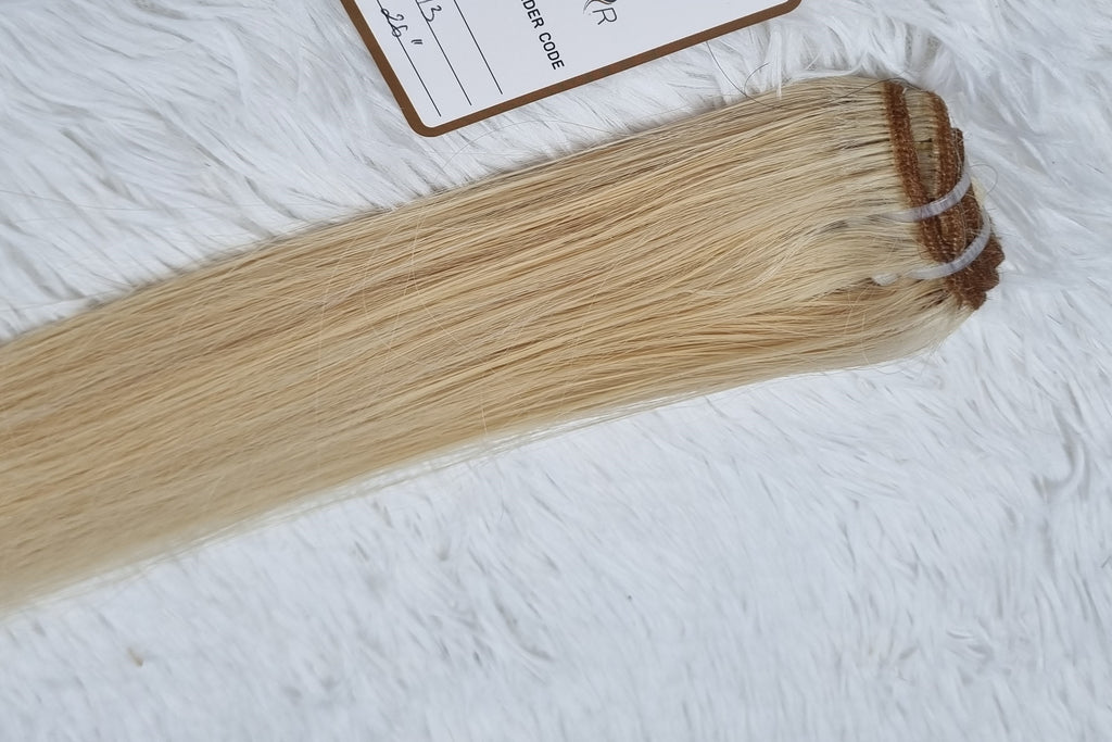 Weave hair extensions medium blonde color