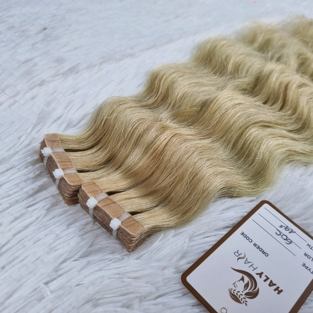 Tape hair extensions light blonde color